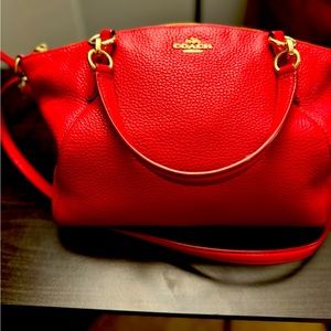 Red Coach purse. Dimensions of 11 x 3 x 9. Adjustable 46 inch shoulder strap.